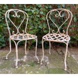 2 old wrought iron bistro chairs