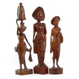 3 Wooden bombarded statues of women, Indonesia 50 cm, 58 cm and 62 cm high