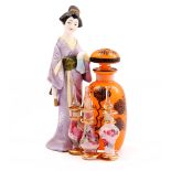 Orange glass perfume bottle with black decorated floral representation 11 cm high, 3 glass decorated