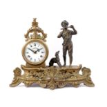 Brass mantel clock with boy and dog playing the flute