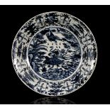 Chinese Wanli porcelain dish with birds in floral landscape decor, 37 cm in diameter (hairlines)
