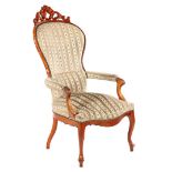 Walnut Biedermeier armchair with bombarded crest