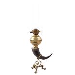 Brass table oil lamp with horn and standing on claw feet