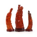 3 Chinese statues made of buffalo horn, 26.30 and 33 cm high on a loose wooden base