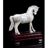 Ivory miniature horse, India ca.1900, 11.4 x 13.5 x 3.5 cm, 169.6 grams. With certificate and wooden