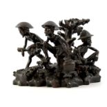 Wooden bombarded sculpture group of workers, Indonesia, early 20th century 28 cm high, 39 cm wide, 2