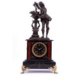 Marble table clock with a cast-iron statue
