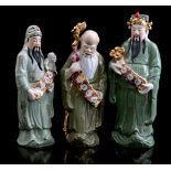 3 porcelain statues of Oriental figures, China 20th century, largest 56 cm high (crown missing)
