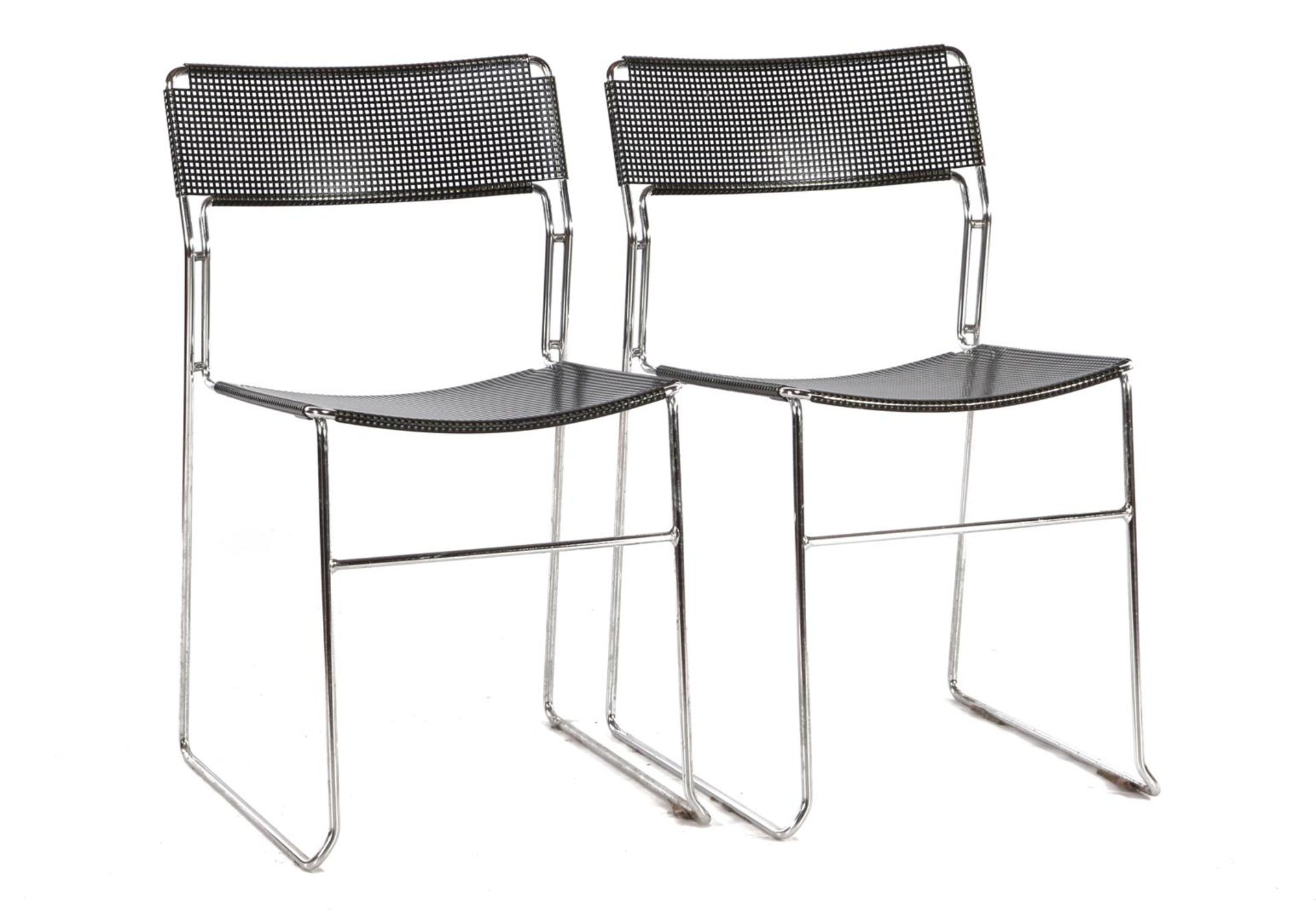 2 chromed metal stacking chairs