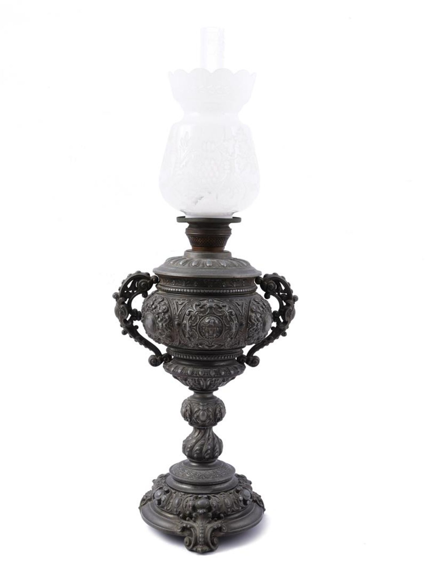 Metal richly worked table oil lamp with polished opaline glass