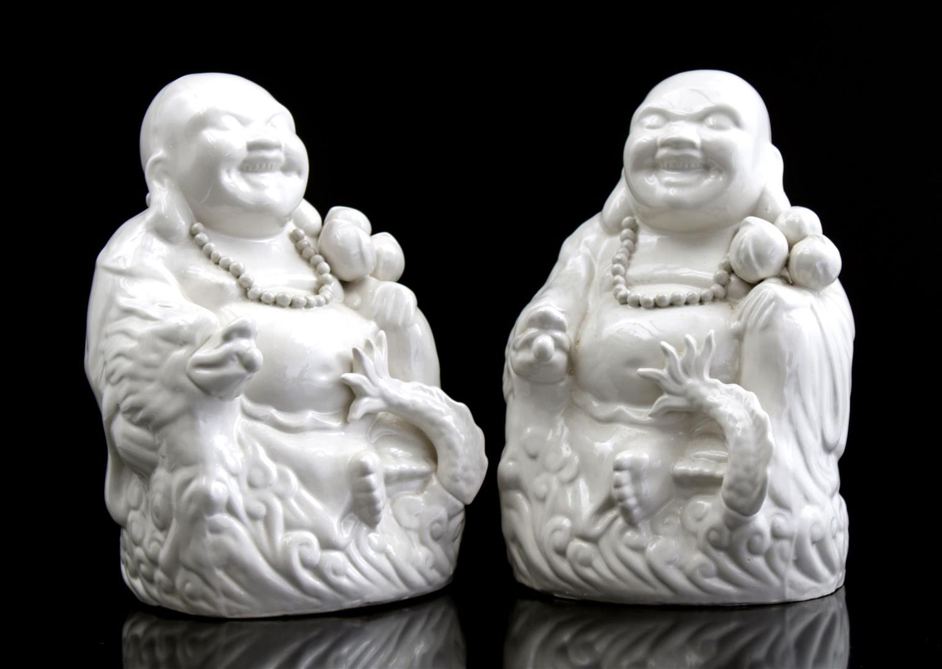 2 porcelain statues Happy Buddha, 31 cm high
