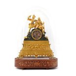 Brass ormolu mantel clock with hunters on top