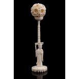 Carved ivory stand with decorated sphere, so-called Devils ball, China ca.1925, 15 cm high, ball 3.5