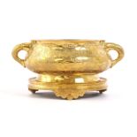 Chinese brass richly decorated incense pot on a plateau, total 12 cm high, 24 cm wide