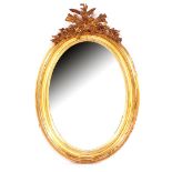 Antique oval mirror in gold-colored frame