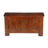 Early 19th century oak blanket chest with gable roof and panels in front