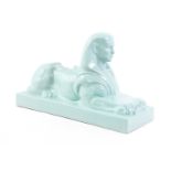 Unmarked, earthenware sculpture of a reclining sphinx