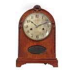 Table clock in oak case with faceted diamond