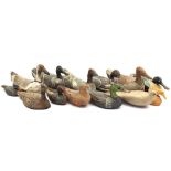 Box with various wooden decoys and pigeon