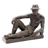 Unsigned, bronze statue of a worker at rest on wooden shoes