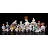 24 porcelain half-dolls and 3 figurines