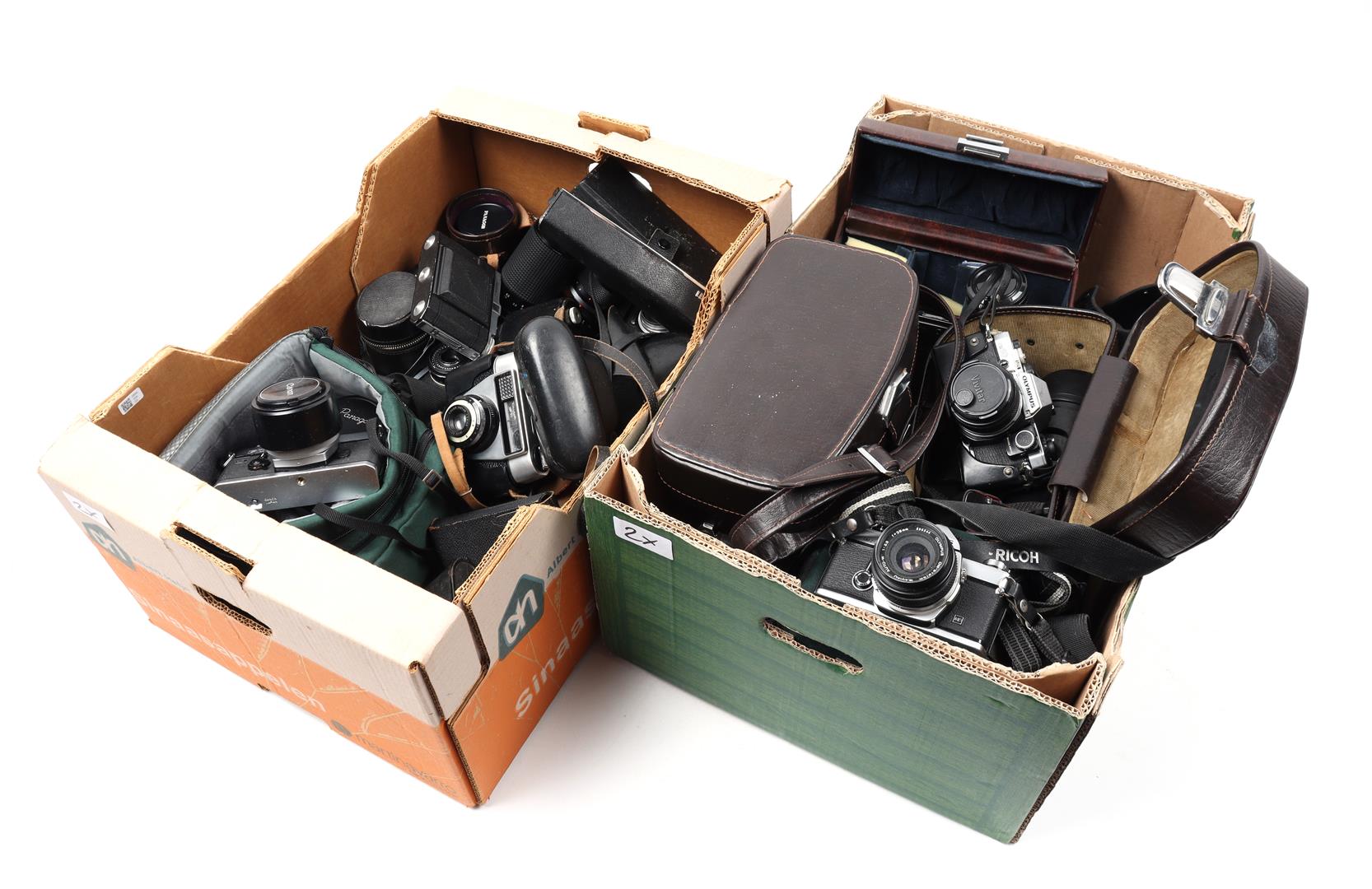 2 boxes of various analog cameras and lenses