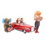 Tin wind-up car with dolls