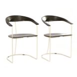 2 white lacquered metal armchairs