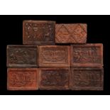 8 terracotta relief tiles with scenes of battles