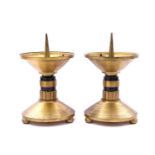 2 brass candlesticks with black rings