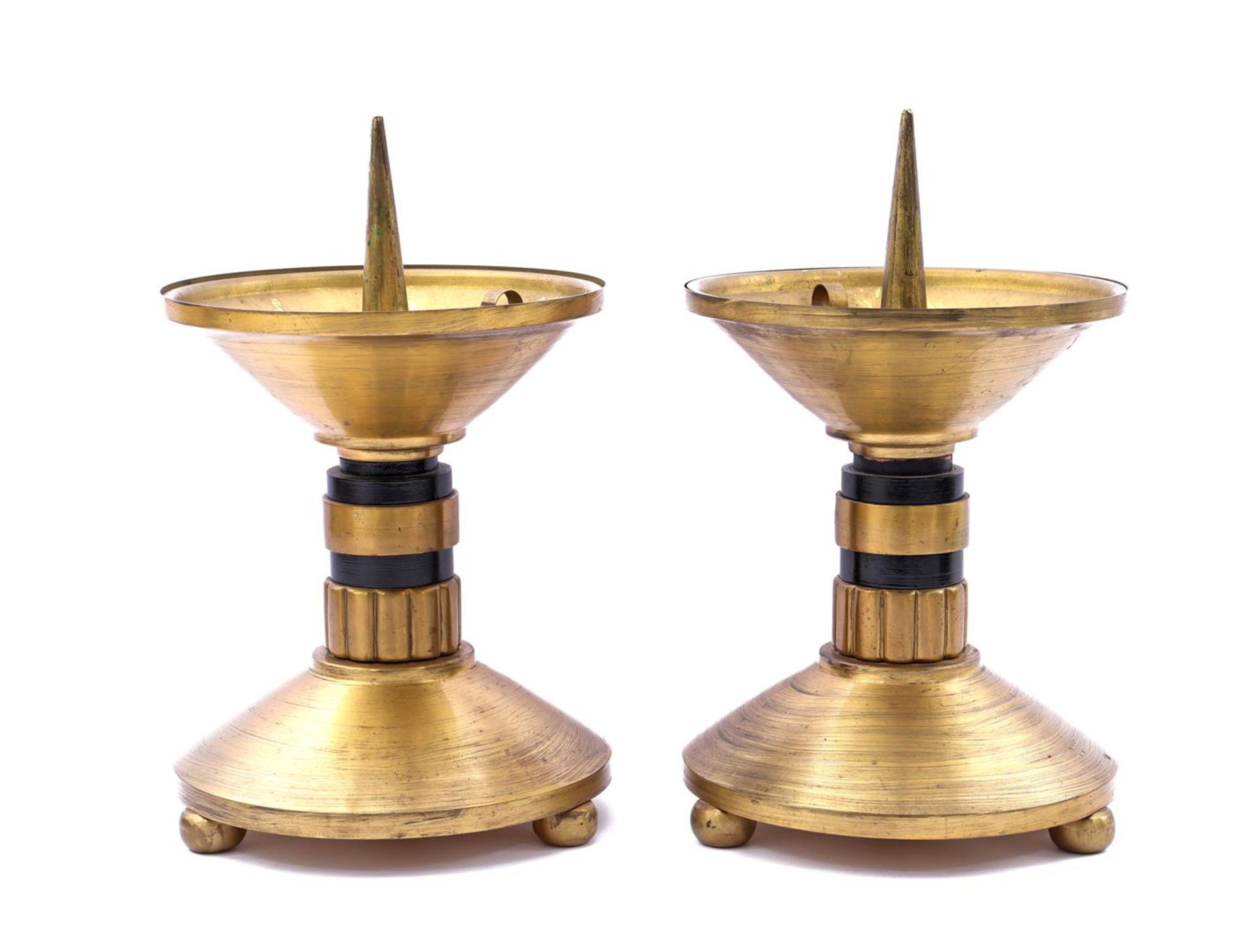 2 brass candlesticks with black rings