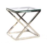 Metal cross legged table with glass