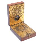 Wooden box with compass sundial on brass