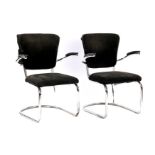 2 tubular frame armchairs