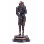 Bronze sculpture of a golfer