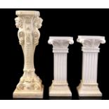 3 white plaster columns