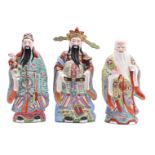 3 glazed earthenware statues