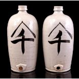 2 glazed earthenware Asian storage bottles