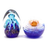 2 colored glass paperweights