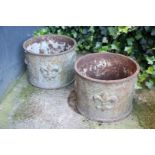 2 round cast iron flower boxes