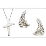 A silver ‘Kiss” pendant designed by Paloma Picasso for Tiffany & Co. and a pair of silver foliate