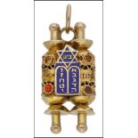 Of Judaica interest: A pendant modelled as The Torah, of openwork design with blue enamel