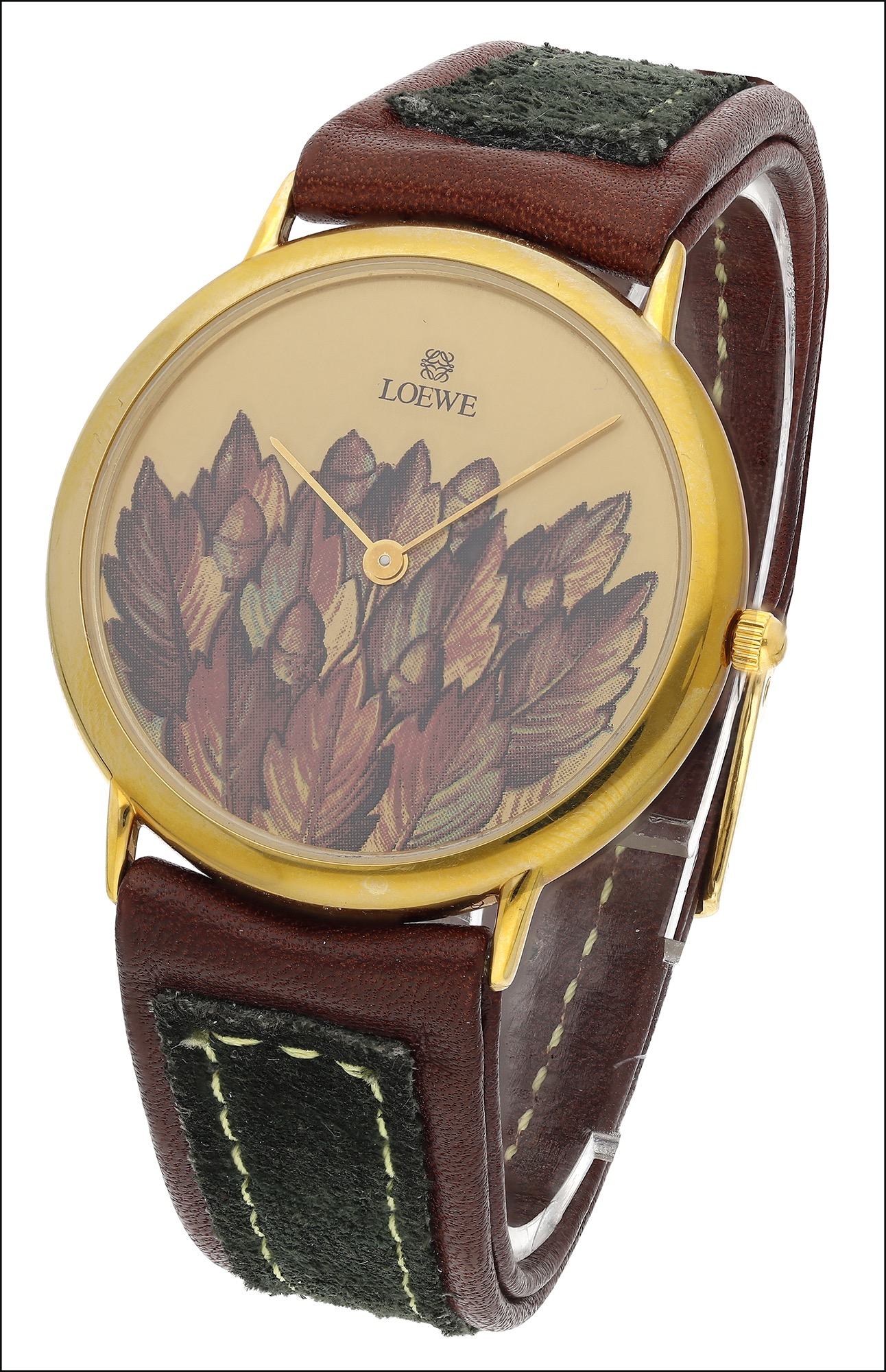 A gilt metal lady’s quartz wristwatch retailed by Loewe, the circular signed champagne-coloured dial