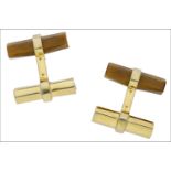 A pair of silver gilt tiger’s eye cufflinks, the tiger’s eye batons to fixed polished silver gilt