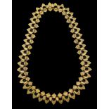 A 19th century gold fringe necklace, with bloomed finish, composed of stylised anthemion and