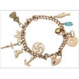 A 9ct gold charm bracelet, the curb-link bracelet stamped ‘9 375’, suspending 13 charms, including a