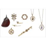 A collection of assorted jewellery, including two late Victorian pendants, a 9ct gold circular and