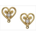 A pair of small 18ct gold and diamond heart-shaped earstuds by Tiffany & Co, the heart design