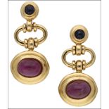A pair of 18ct ruby and sapphire earrings, the three tier earpendants composed of a collet set