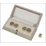 A pair of early 20th century rock crystal and diamond cufflinks with matching single dress stud, the